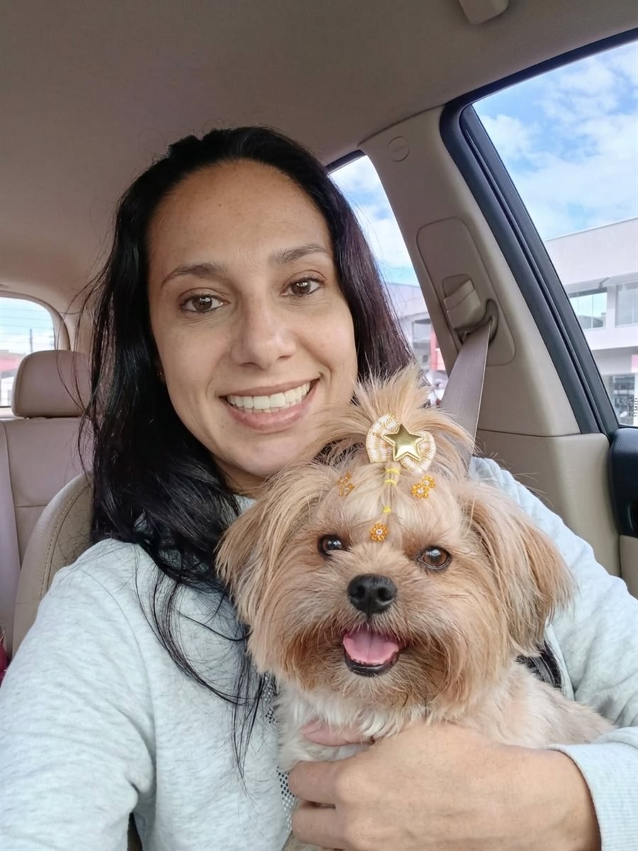 Mila Bruck holding Vicky, her adult Yorkshire Terrier